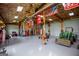 Large garage space with tractor, tools, and multiple American and military themed flags at 385 Liberty Church Rd, Carrollton, GA 30116