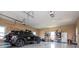 Spacious garage with shelving, car, and white refrigerator at 385 Liberty Church Rd, Carrollton, GA 30116