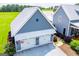 Detached garage with white doors, metal roof, and a patriotic American flag at 385 Liberty Church Rd, Carrollton, GA 30116