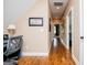 Well-lit hallway featuring hardwood floors and neutral paint, creating a bright and inviting space at 385 Liberty Church Rd, Carrollton, GA 30116