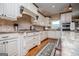Gourmet kitchen featuring custom cabinets, granite countertops, and stainless steel appliances at 385 Liberty Church Rd, Carrollton, GA 30116