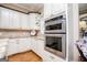 Modern kitchen features stainless steel double ovens, custom cabinets, and granite countertops at 385 Liberty Church Rd, Carrollton, GA 30116