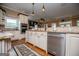 Bright kitchen features stainless steel appliances, granite countertops, and a view of the Gathering room at 385 Liberty Church Rd, Carrollton, GA 30116