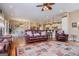 Open living room with view to kitchen, dining area, and staircase at 385 Liberty Church Rd, Carrollton, GA 30116