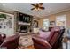 Inviting living room with stone fireplace, built-ins, and comfortable seating at 385 Liberty Church Rd, Carrollton, GA 30116