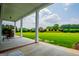 Relaxing view from a covered porch showcasing lush greenery and a serene outdoor setting at 385 Liberty Church Rd, Carrollton, GA 30116