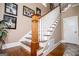 This is a stairway with hardwood steps and white wood risers and railings at 385 Liberty Church Rd, Carrollton, GA 30116