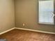 Inviting bedroom featuring plush carpeting, neutral tones, and a window with natural light at 5057 Windsor Forrest Lane, Atlanta, GA 30349