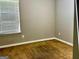 Neutral bedroom featuring carpeting, two power outlets, and a window with blinds at 5057 Windsor Forrest Lane, Atlanta, GA 30349