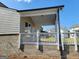 Brick back porch with white railings, perfect for entertaining or relaxing at 35 Fraser Ln # 123B, Auburn, GA 30011