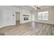 Open-concept living room with a fireplace and stylish flooring at 35 Fraser Ln # 123B, Auburn, GA 30011