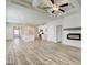 Open-concept living area with modern fireplace, coffered ceilings, and hardwood floors at 35 Fraser Ln # 123B, Auburn, GA 30011