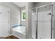 Inviting bathroom features a large soaking tub and a separate glass shower at 205 N Strathmore Dr, Sharpsburg, GA 30277