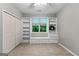 Inviting bedroom with built-in shelves, storage, and plenty of natural light at 205 N Strathmore Dr, Sharpsburg, GA 30277