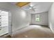 Expansive bonus room with natural light; great for office, play, or storage at 205 N Strathmore Dr, Sharpsburg, GA 30277