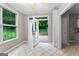Bright breakfast nook with tile floor, exterior door, and built-in shelving at 205 N Strathmore Dr, Sharpsburg, GA 30277