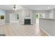 Spacious living room boasting an open layout, fireplace, and seamless flow to adjoining areas at 205 N Strathmore Dr, Sharpsburg, GA 30277