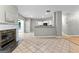 Spacious living room with a fireplace, and an open floor plan leading to the kitchen at 205 N Strathmore Dr, Sharpsburg, GA 30277
