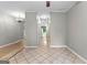 Spacious room showcasing tile floors, neutral walls, and a seamless transition to other spaces at 205 N Strathmore Dr, Sharpsburg, GA 30277