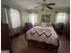 Bright bedroom with hardwood floors, ceiling fan and natural light at 2534 Highway 155 N, Mcdonough, GA 30252