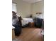 Bedroom full of packed boxes, a bed, and a small desk at 2534 Highway 155 N, Mcdonough, GA 30252