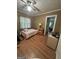 Bedroom with light-colored walls, wood floor, and ceiling fan at 2534 Highway 155 N, Mcdonough, GA 30252