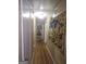 Hallway featuring hardwood floors and artwork at 1110 Hilburn Se Dr, Atlanta, GA 30316