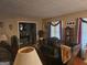 Cozy living room featuring decorative curtains, plush seating and hardwood floors at 1110 Hilburn Se Dr, Atlanta, GA 30316