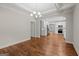 Open dining and kitchen area with hardwood floors and coffered ceiling at 55 Etheridge Rd, Temple, GA 30179