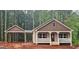 Charming single-story home with a welcoming front porch and convenient carport at 55 Etheridge Rd, Temple, GA 30179