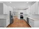 Modern kitchen featuring white cabinets, stainless steel appliances, granite countertops, and subway tile backsplash at 55 Etheridge Rd, Temple, GA 30179