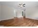 Open-concept living room with hardwood floors seamlessly connecting to the kitchen and dining area at 55 Etheridge Rd, Temple, GA 30179