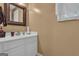 Bathroom with a white vanity, stylish mirror, and modern fixtures at 15 Skipton Ct, Sharpsburg, GA 30277