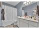 Nicely appointed bathroom with a tub and shower combo, vanity, and ample counter space at 15 Skipton Ct, Sharpsburg, GA 30277