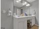 Bathroom with a double vanity, white cabinetry, and neutral walls at 15 Skipton Ct, Sharpsburg, GA 30277