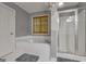 Bathroom featuring a soaking tub, glass-enclosed shower, and stylish finishes at 15 Skipton Ct, Sharpsburg, GA 30277