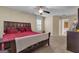 Comfortable bedroom featuring neutral carpet, ceiling fan, and a comfortable bed at 15 Skipton Ct, Sharpsburg, GA 30277