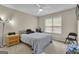 Cozy bedroom featuring a ceiling fan, natural light, and comfortable furnishings at 15 Skipton Ct, Sharpsburg, GA 30277
