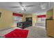 Spacious bedroom with black furniture and red accents offers a relaxing retreat at 15 Skipton Ct, Sharpsburg, GA 30277