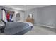 Light-filled bedroom showcasing a well-organized closet and classic decor at 15 Skipton Ct, Sharpsburg, GA 30277
