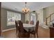 Bright dining room with traditional furniture and natural light at 15 Skipton Ct, Sharpsburg, GA 30277