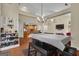 Bright dining room featuring a chandelier, hardwood floors, and an open view of the kitchen at 15 Skipton Ct, Sharpsburg, GA 30277