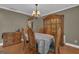 Elegant dining room featuring stylish furnishings and ample natural light at 15 Skipton Ct, Sharpsburg, GA 30277