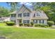Attractive two-story home with a well-kept lawn and welcoming entrance at 15 Skipton Ct, Sharpsburg, GA 30277