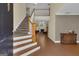 Inviting foyer with staircase and hardwood floors at 15 Skipton Ct, Sharpsburg, GA 30277