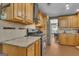 Kitchen with stainless steel range, granite countertops, and ample wood cabinetry at 15 Skipton Ct, Sharpsburg, GA 30277