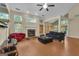 Spacious living room featuring a fireplace and lots of natural light at 15 Skipton Ct, Sharpsburg, GA 30277