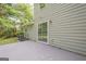Exterior home view showing a patio, AC unit, wood siding, and sliding glass doors at 2576 Abbotts Glen Nw Dr, Acworth, GA 30101