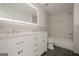 Bathroom with double vanity, tiled shower, and modern finishes at 2576 Abbotts Glen Nw Dr, Acworth, GA 30101