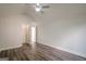 Vaulted bedroom featuring hardwood floors, a ceiling fan, and a walk-in closet at 2576 Abbotts Glen Nw Dr, Acworth, GA 30101